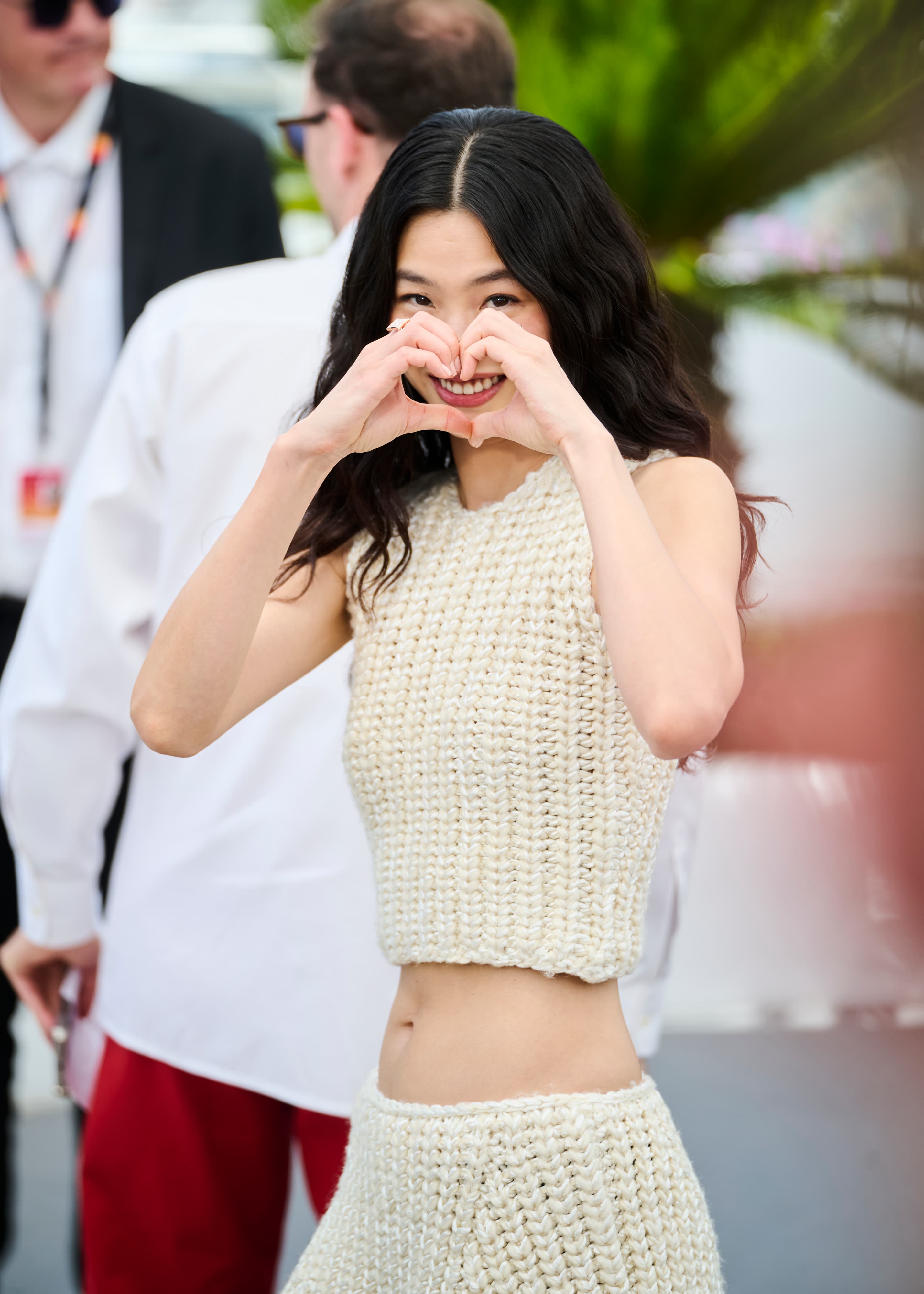 Jung Ho-yeon making a heart at the Cannes Film Festival photocall in May 2026